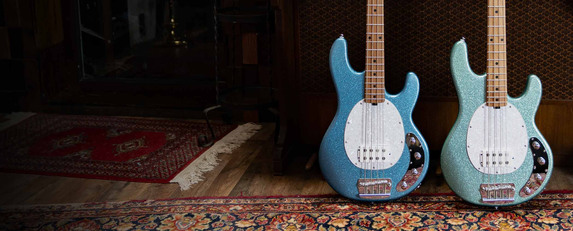 The StingRay Ray35 bass in Ash resting on a vintage chair.