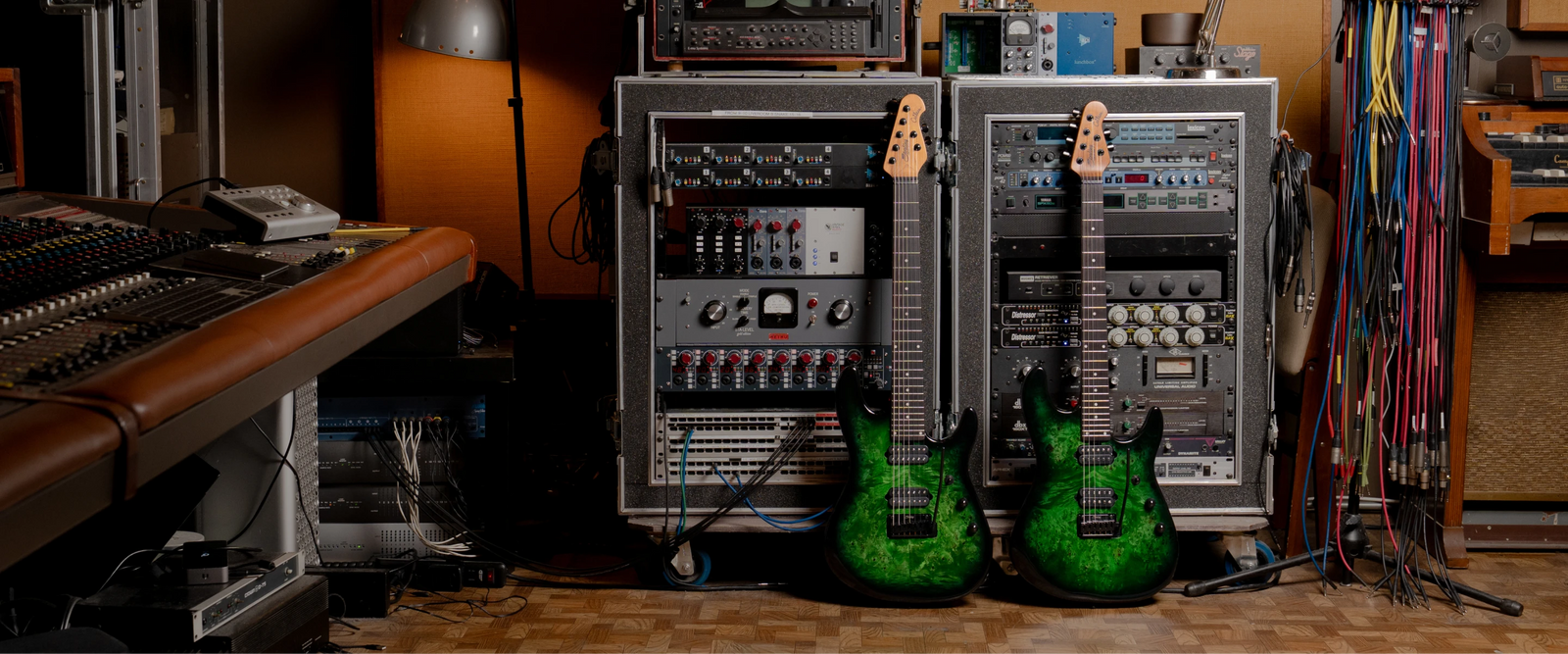 two richardson guitars in front of a control board